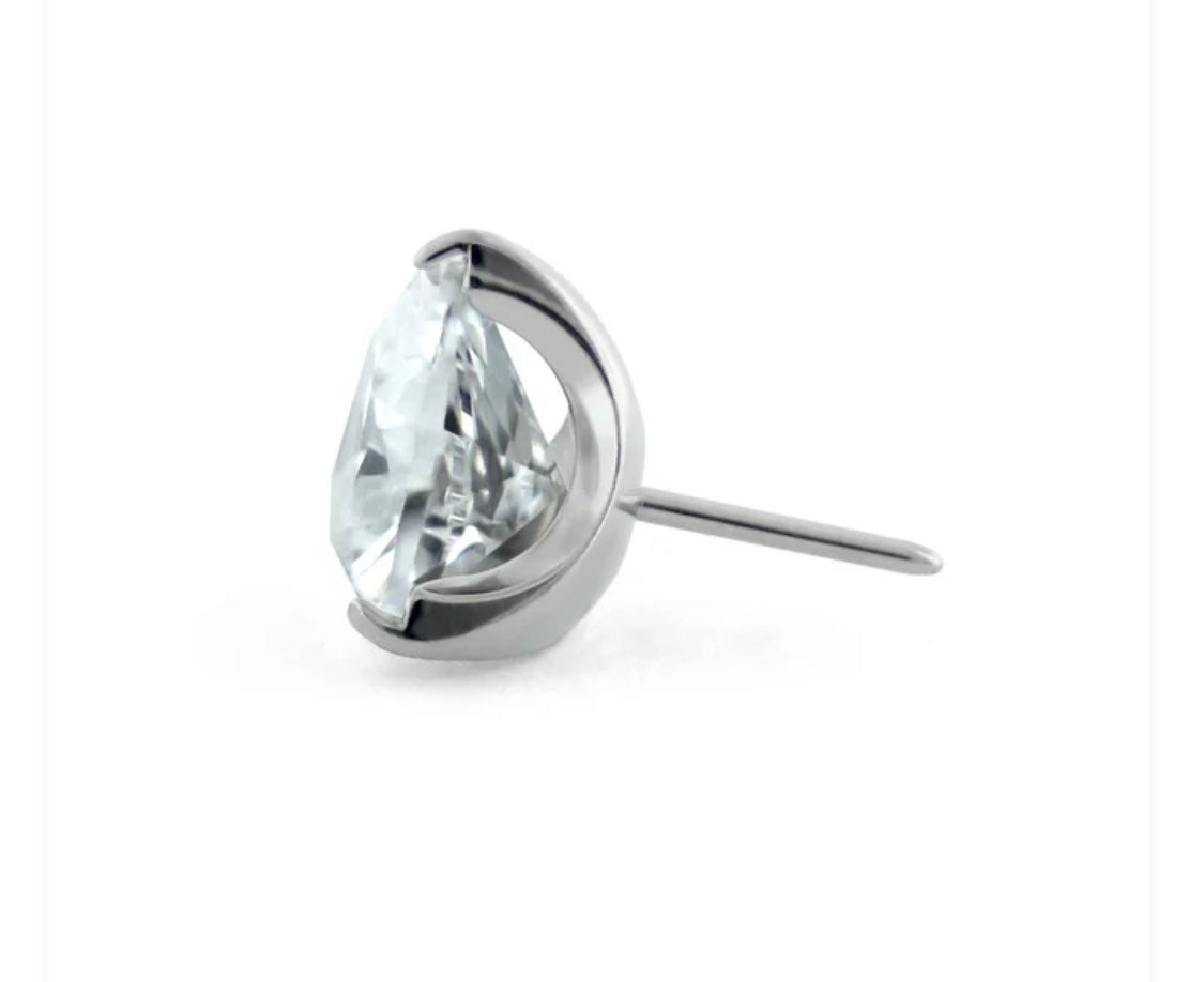 Close-up of implant-certified titanium trillion cut threadless top 3.3mm x 3.7mm showing delicate prong setting
