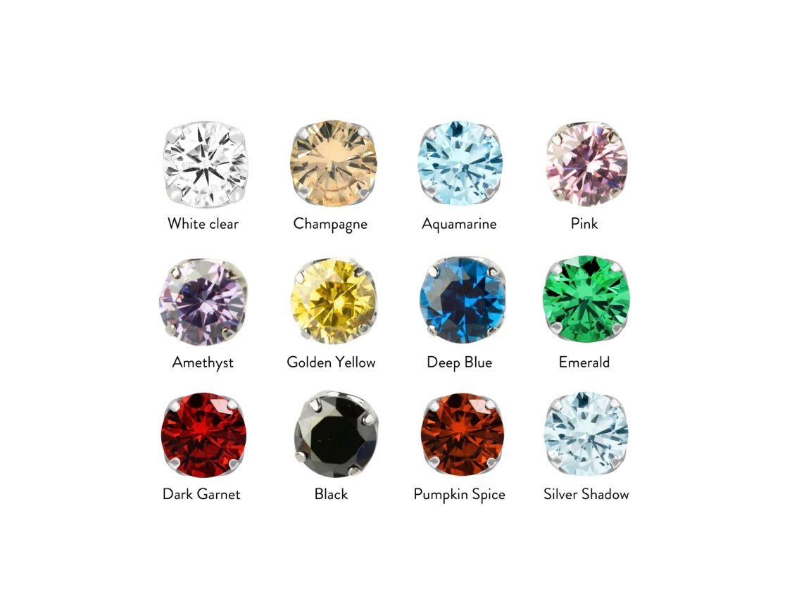 Close-up of mirror-polished implant-grade titanium CZ prong threadless tops available in multiple colours and sizes